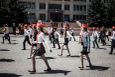 Kyrgyz high-school students march on a rehearsal for the Great Victory Day parade around Karakol city's main square. Karakol, Yssik-Kul region.